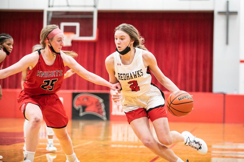 Marist' Elise Ward (2) drives to the basket while being guarded by Lincoln-Way Central's Nicole Connolly (25) during a game in Chicago on Wednesday Dec.1, 2021.